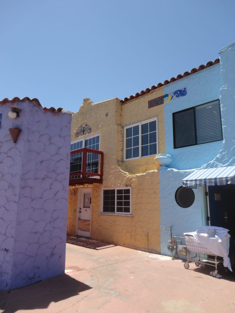 colorful buildings sky laundry cart
