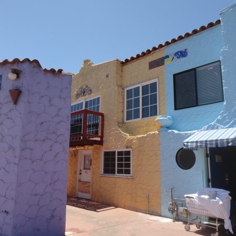 colorful buildings sky laundry cart